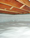 a moisture barrier installed on the walls and floors of a crawl space in Bigelow