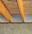 SilverGlo™ insulation installed in a floor joist in Bauxite