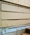 an old-fashioned crawl space door in Casa about to be replaced