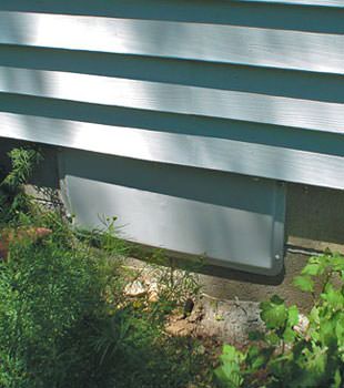 A gray crawl space vent cover in Scott
