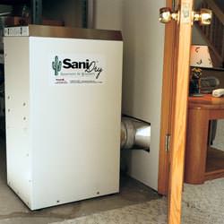 A basement dehumidifier ducting dry air into a finished area of the basement  in Little Rock