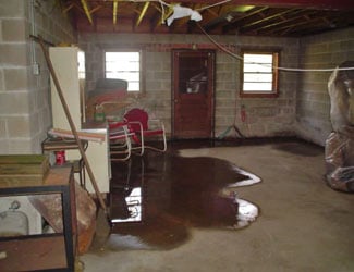 a flooded basement floor in a Little Rock home