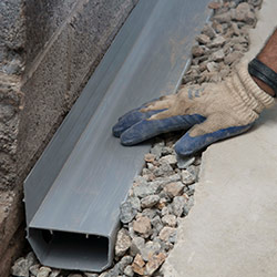 installing a drain tile system in a Wrightsville home